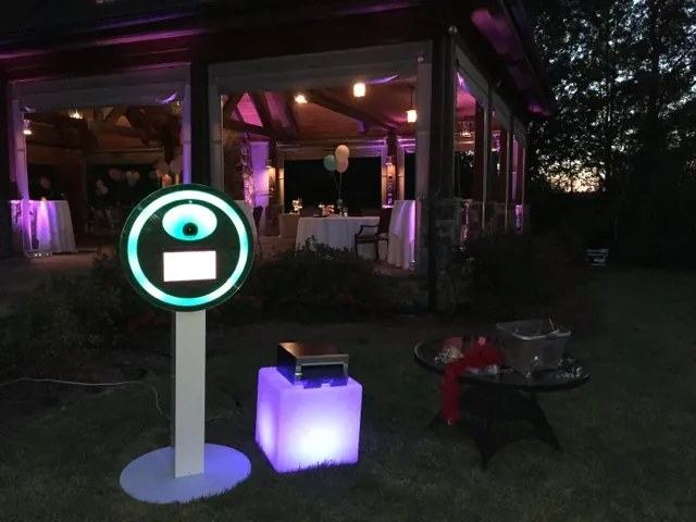 The Digital Burst booth set up outdoors at an evening reception